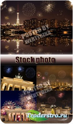      / Celebratory fireworks over night city - stock photos
